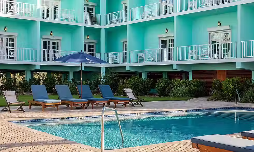 Pool beside the turquoise Conch House rooms at Grassy Flats Resort