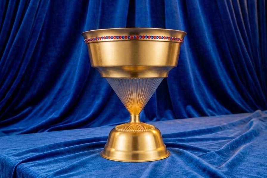 Gold Trophy with blue & orange stones along the top