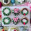 Thumbnail: Six Christmas cupcakes decorated with buttercream wreaths, pink bows, holly leaves, and festive detailing.