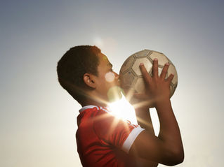 kissing football