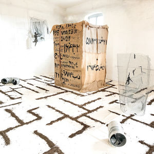 Identity, 2024, installation view, foam, wire, fence, metal tubes, soile, jute, gauze, acrylic and charcoal, 800 x 500 x 500 cm (315 x 196 x 196 in), Halesworth, UK

The rebellious figures inside of the closed cage  have moving through applied fan, and are visible only from outside, through small holes applied on four sides of the box