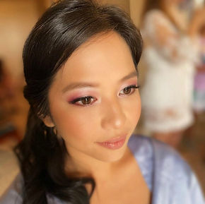 Colorful eye shadow with nude lipstick.