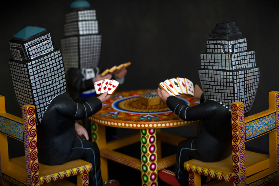 Designed and Conceived by Rombo (b. 1993)
Interpreted and Fabricated by Agustin Cruz Prudencio (b. 1984)
Painted Carved Copal Wood, 2021
Brookfield Place (previously named and still commonly referred to as the World Financial Center) is a shopping center and office building complex in the Battery Park City neighborhood in Lower Manhattan. Naturally, Rombo dressed them as bankers and imagined them doing what they do best, gambling.
Rombo designed this piece uniquely for Agustin, who interpreted Rombo's idea brilliantly, incorporating his own style and technique. Agustin introduced vibrant colors and patterns that are of his own vision and cultural Zapotec heritage. We will soon introduce you further to Agustin and his work.