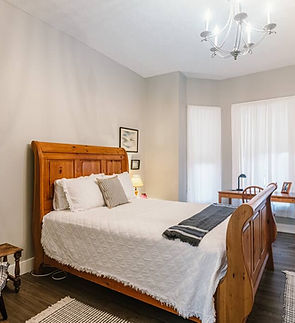 bedroom with wooden bed frame
