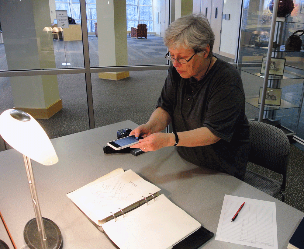 Photo of Susan Timmins, researching in the Archives