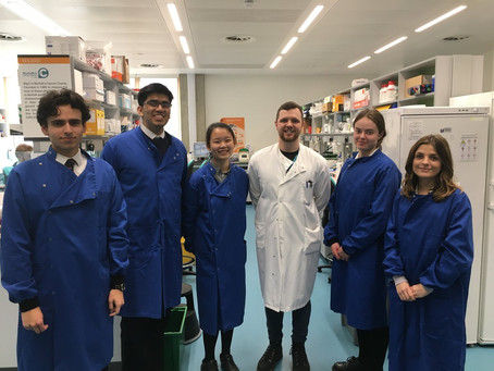 Jamie showing Norwich School students around the lab.
