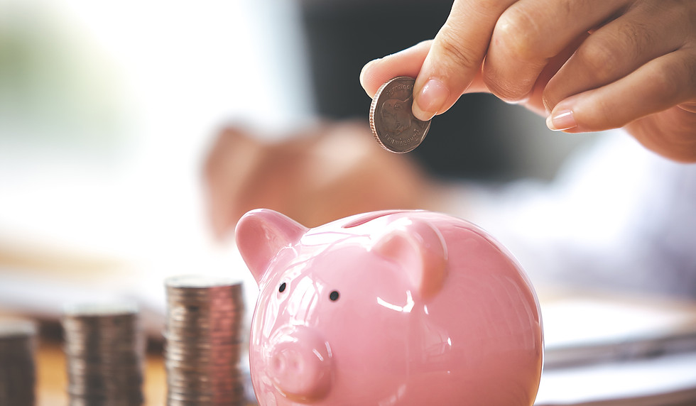 businessman-holding-a-coin-in-a-piggy-bank-on-a-ta-2026-03-23-23-33-11-utc.jpg