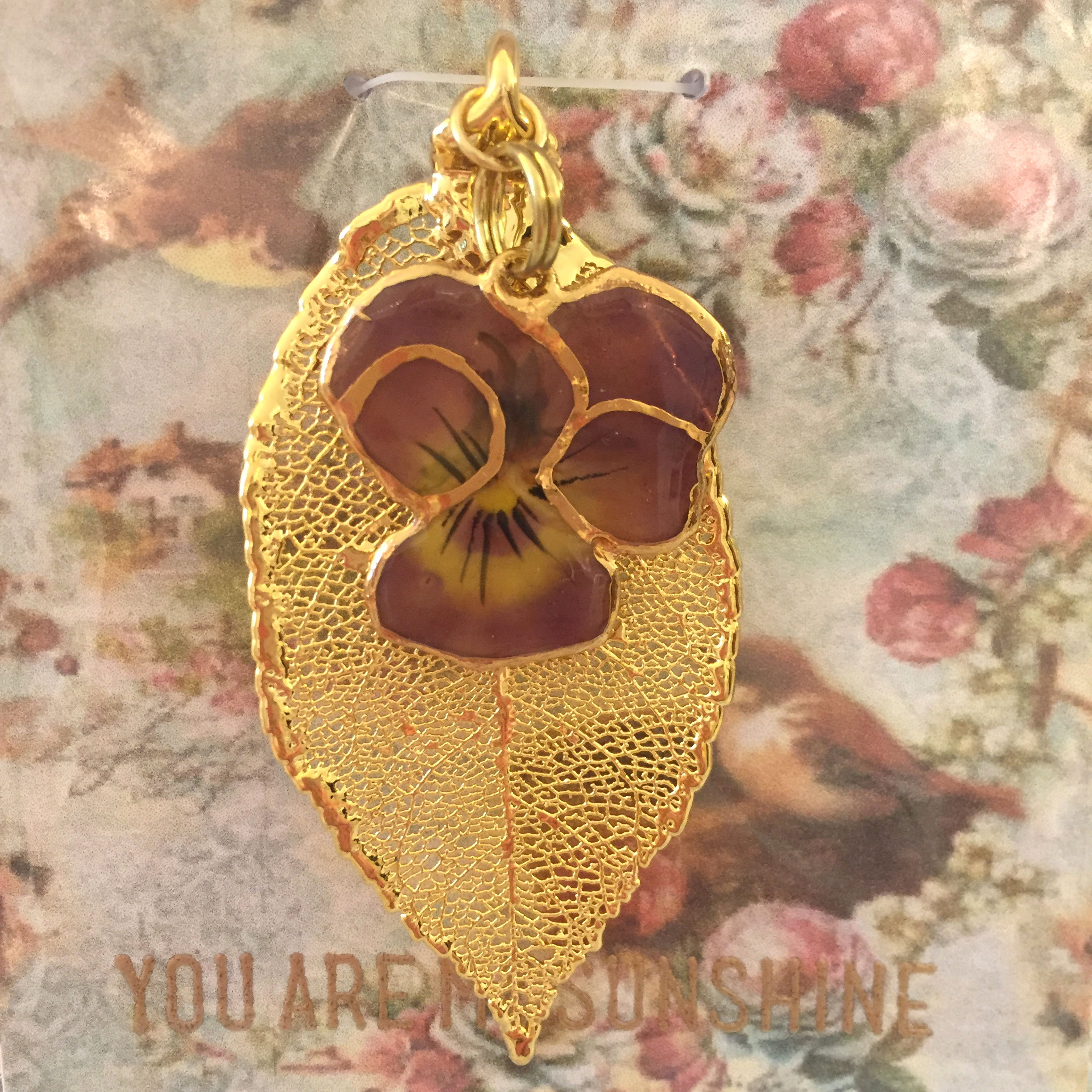 A Real Rose Leaf & a Viola Flower Merlot Outlined in 24K Gold Pendant
