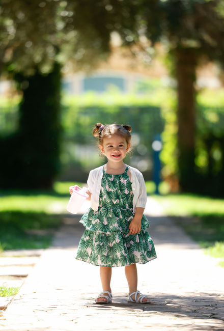 beautiful toddler girl posing in front of camera by Hyunah Jang photography during the family photography session in San Francisco Bay Area