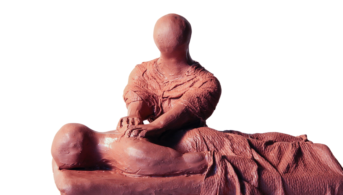 Terracotta colored sculpture of one figure massaging another, with detailed, textured folds in drapery.