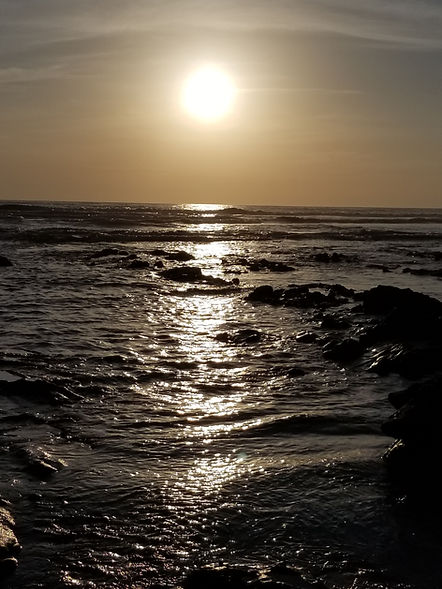 Setting sun over the water.