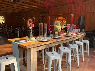 table scape of community style table for a wedding reception at Riverain Farm in Greenville, SC