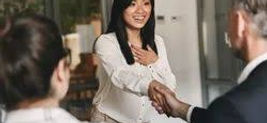 Happy job candidate shaking hands, successful interview