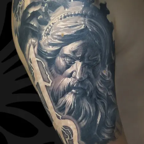 Black and grey Realism arm tattoo of Posidon portrait by Serjo bronfman at Serjo Tattoo Tel-aviv.