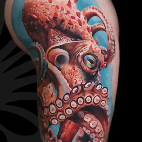 Color Realism thigh tattoo of an Octopus by Mai zait at Serjo Tattoo Tel-aviv.