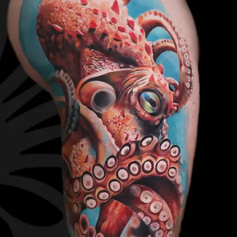 Realistic color octopus thigh tattoo in Tel Aviv.