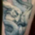 Realistic rabbit and snake sculpture thigh tattoo inspired by Beth Cavener in Tel Aviv.