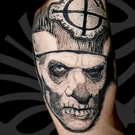 Black and grey realistic Ghost band portrait inner arm tattoo in Tel Aviv.