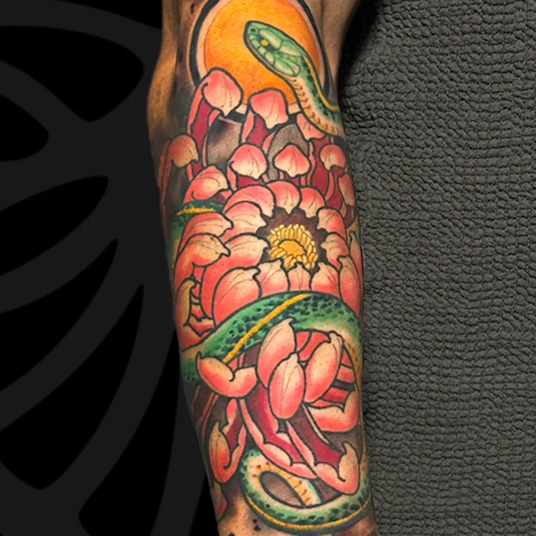 Color Neo-japanese arm tattoo of Snake and chrysanthemum by Serjo bronfman at Serjo Tattoo Tel-aviv.