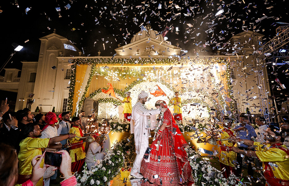 Ganga Aarti inspired jai mala ceremony captured with spiritual elegance and cinematic wedding storytelling