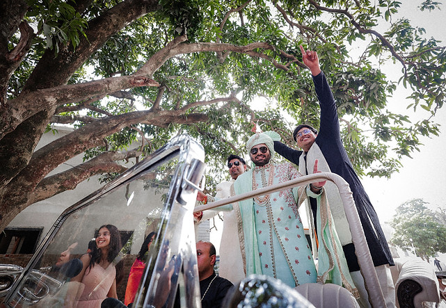 Groom enjoying every moment of his joyous baraat celebration.