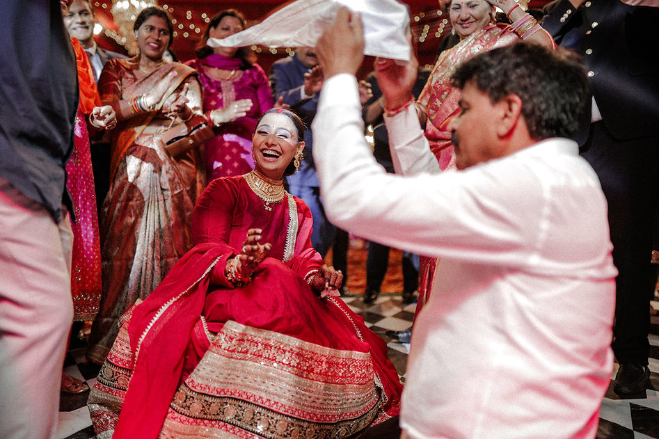A heartwarming dance floor moment shared between family and friends.