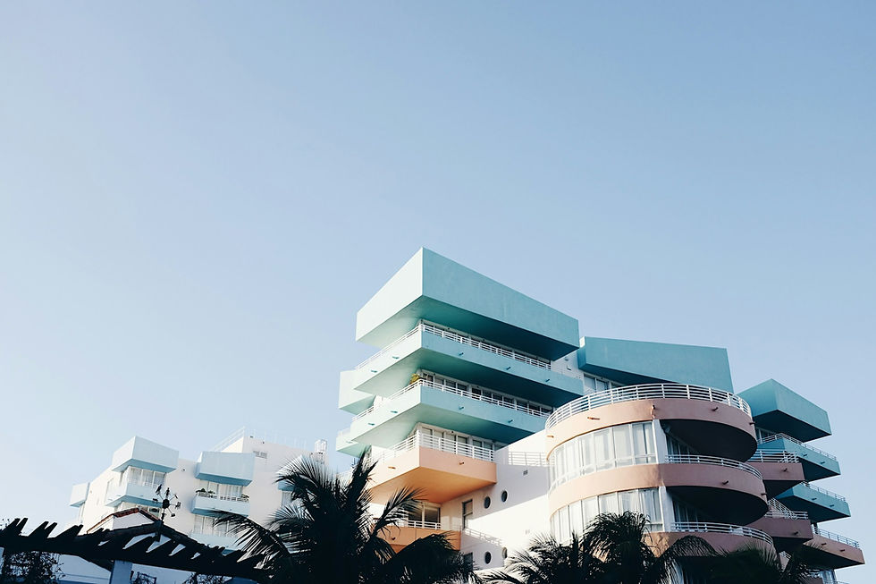 colorful high-rise building with palm trees