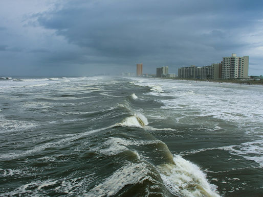 crashing waves along the shore during a storm
