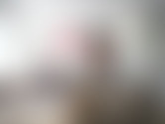 man sitting at a table in front of a laptop