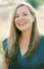 Anna Danforth Smiling outdoors for author photo
