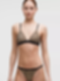 Woman in leopard print bralette and tanga brief