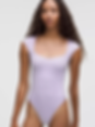 woman in ilac bodysuit