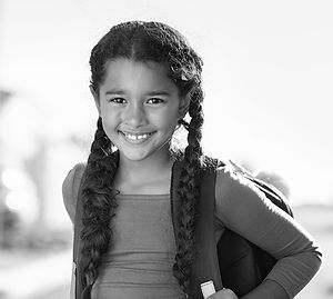 SchoolGirlwithBraidsandBackpack.jpeg