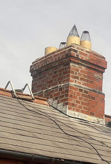 Brick chimney with roof flashing requiring repairs
