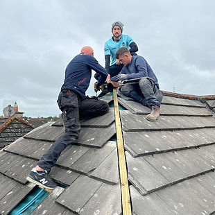 Roof being repaired by roofers