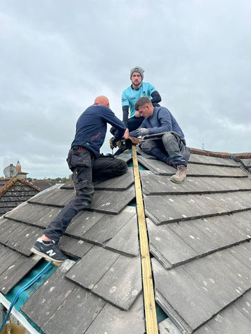 Jim's Roofing Roofers fixing the site