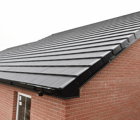 New black roof tiles on a brick house