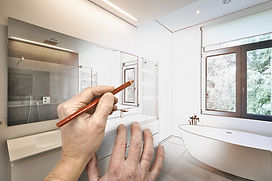 Hands sketching modern bathroom design