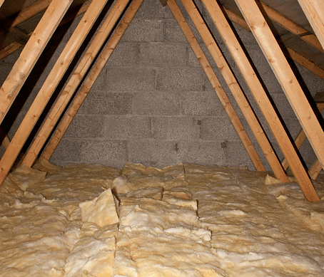 Insulated attic with wooden beams