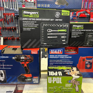 Selection of tools: Drill, socket set, U-POL