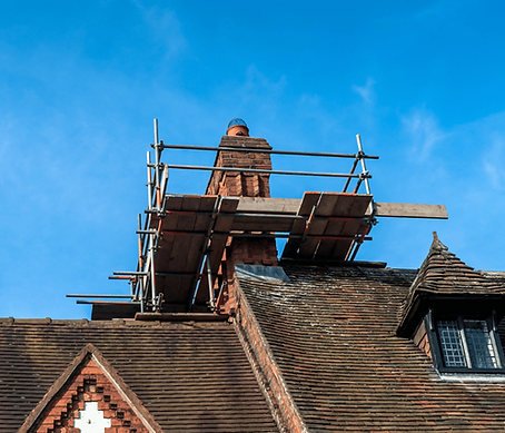 Chimney scaffolding and repair work on a building
