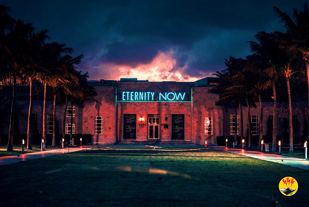 A nightclub at dusk with a neon sign reading "Eternity Now"