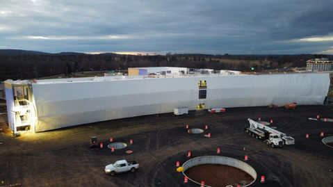Temporary weather enclosure using shrink wrap by Global Wrap.