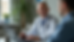 Eye-level view of a patient consulting a physician via telehealth on a laptop