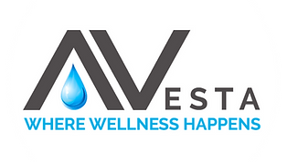 White circle in a gray box with rounded edges. Avesta Logo in the center with the A missing the middle line and replaced by a water droplet. Avesta is written in black. The water droplet is blue. The slogan, "Where Wellness Happens" written in blue underneath.