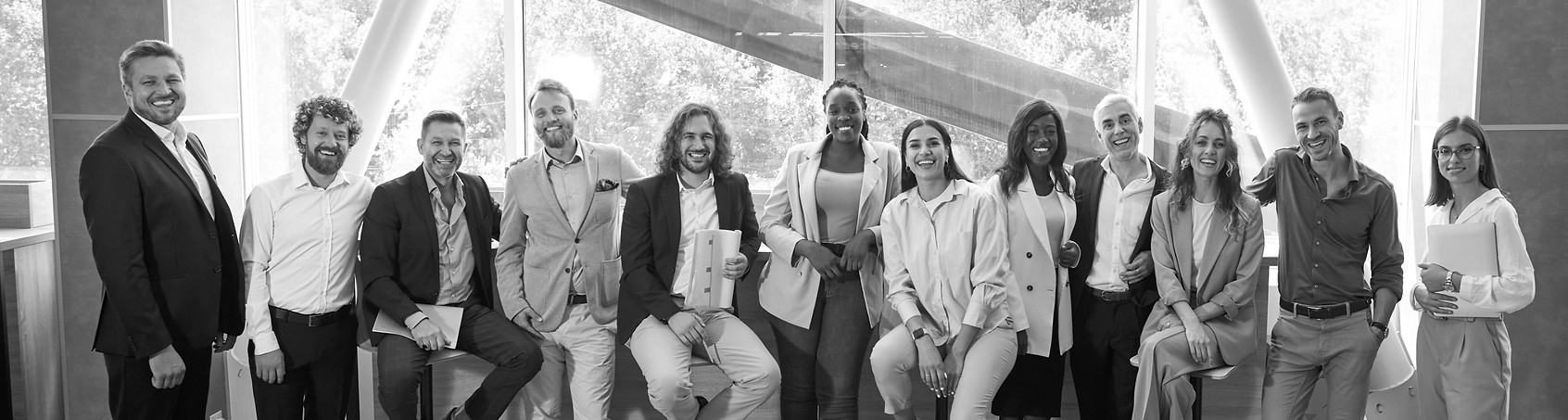 Team of happy diverse people meeting at professional business event. Group portrait smilin
