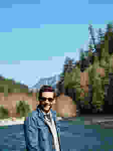 Cody posing in front of mountains