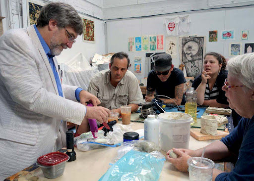 Pojman at table with artists.jpg