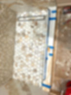 tileable linear drain in a tub to shower conversion with hexagon marble tile