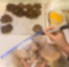 flash frozen maple sausage breakfast patties, cheese and english muffins in the background and a hand writing on a gallon size zipper bag that says "sausage cheese english muffins"